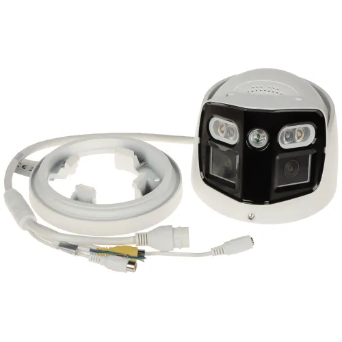 Na zdjęciu znajduje się kamera monitoringu z wyjętym pierścieniem zaciskowym, obok której leży kabel z różnymi złączami. Kamera ma biało-czarną obudowę i kilka widocznych obiektywów oraz diod.