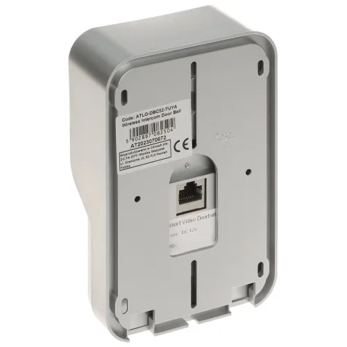 Zdjęcie przedstawia tylną część bezprzewodowego dzwonka wideo z widocznym miejscem na kabel Ethernet oraz etykietą z informacjami technicznymi. Obudowa urządzenia jest w kolorze szarym, a na środku znajduje się gniazdo sieciowe.