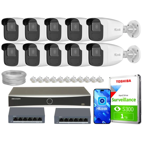 Zestaw do monitoringu składający się z dziesięciu kamer IP, rejestratora, dwóch switchów, dysku twardego Toshiba oraz akcesoriów montażowych. Kamery i sprzęt są ułożone na białym tle, prezentując kompletny system nadzoru.